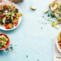 Bowls of fresh food laid out on a table